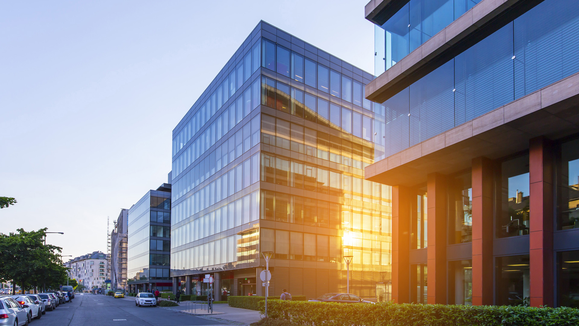 Glass and metal buildings line a street in a US city