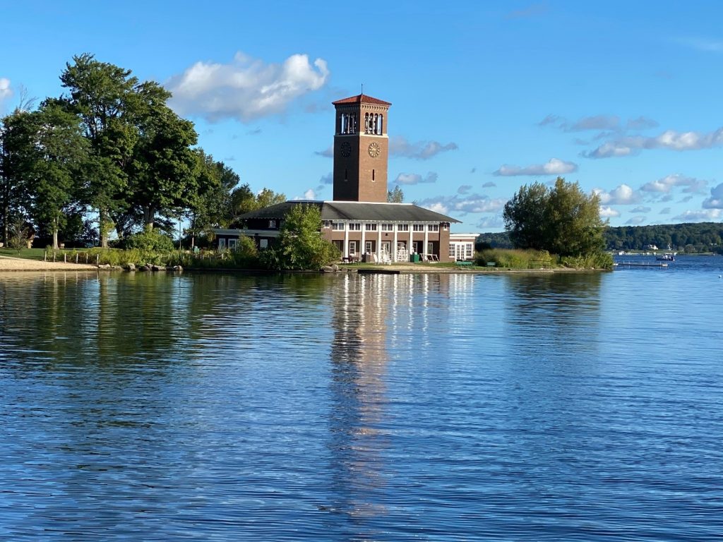 A clock tower and historical building on the bank of Lake Erie