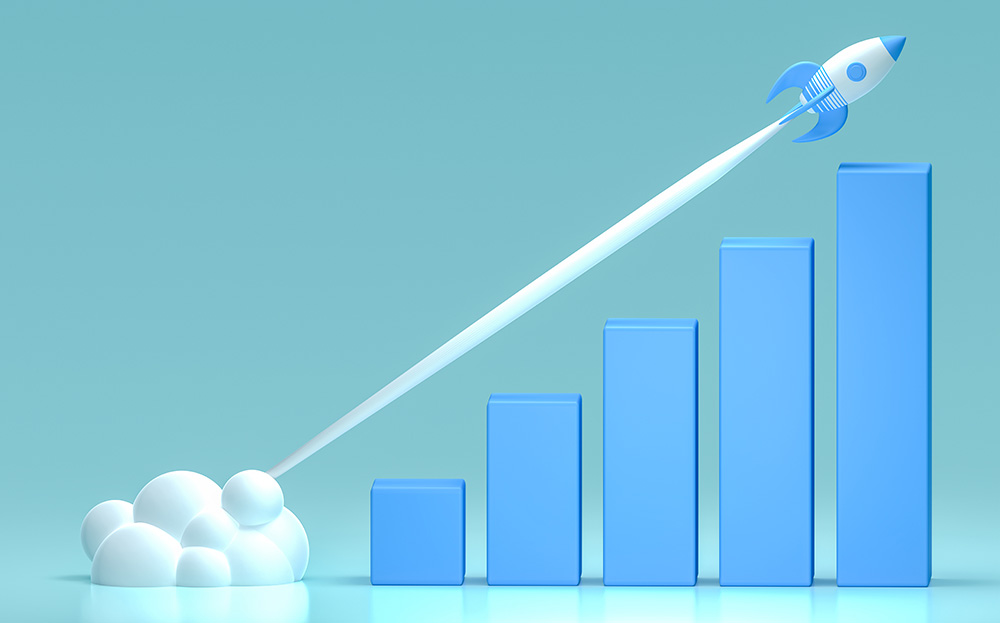 A steadily increasing bar chart with a rocketship blasting off above it representing economic growth and momentum.