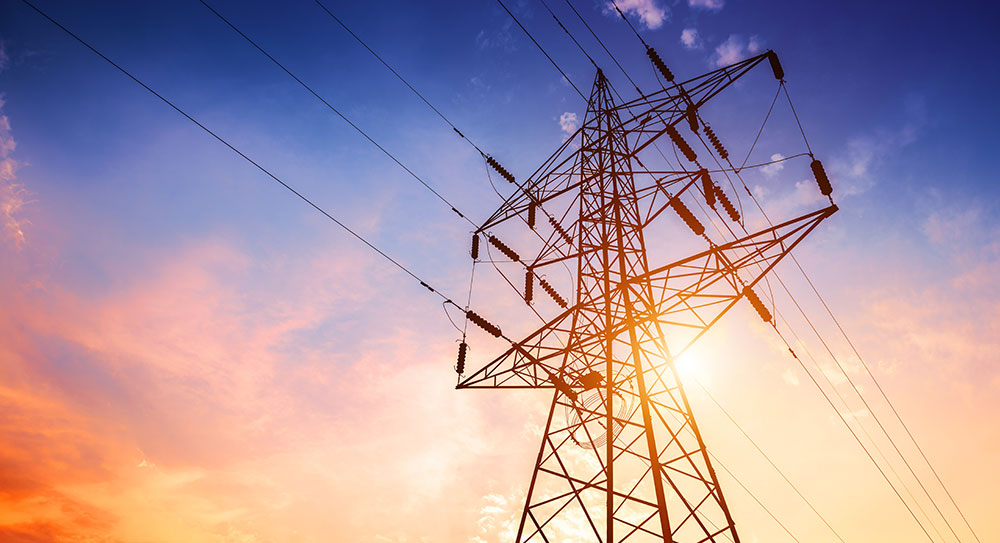 A large metal tower carrying power lines