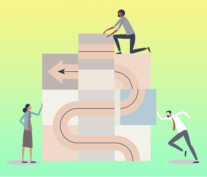 An illustration representing organizational change shows three people working together to create a pathway by pushing together large puzzle pieces with pieces of a completed path printed on them