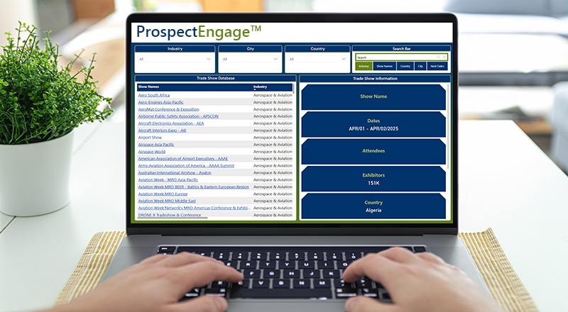 Hands type on the keyboard of a laptop computer with the ProspectEngage Trade Show Database on the screen