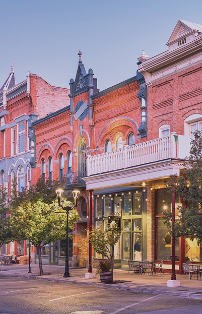 A photo of an historic downtown street lined with retail storefronts